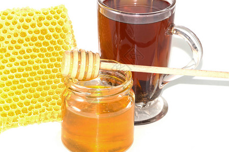 茶和蜂蜜梳子里的蜂蜜图片