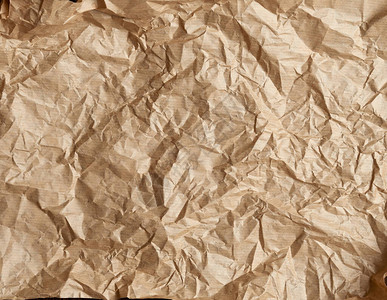 折叠的棕色羊皮纸烤纸图片
