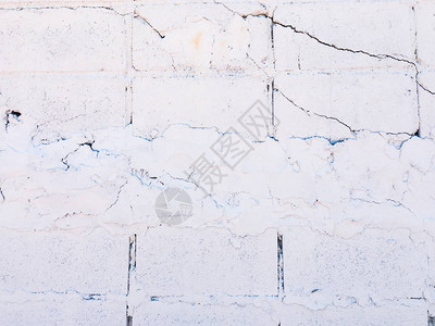 白色砖墙纹理与设计的裂纹背景图片