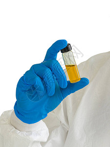 一种瓶子含有研究人员手中的黄色化学物质图片