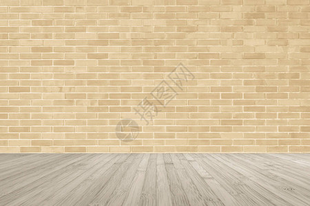 浅黄色棕色砖墙木地板上背景图片