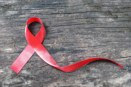 世界艾滋病日活动的红丝带意识支持艾滋传播疾病图片