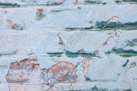 在红砖墙壁纹理的老蓝色膏药复古腻子建筑背景复制空间时尚的绿松石表面图片