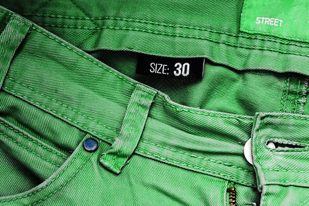 四十码的绿色牛仔裤牛仔裤口袋和牛仔布背景男式或女式长裤特写街头时尚服图片