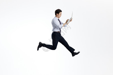 跳跃商务男士跳跃的商务男士笔记本电脑办公背景