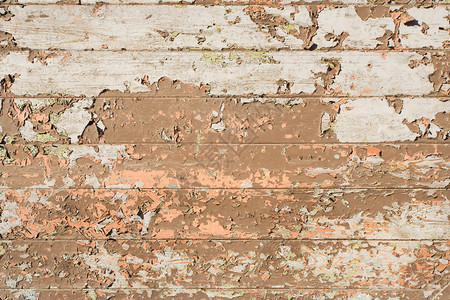 油漆剥落的grunge木墙图片
