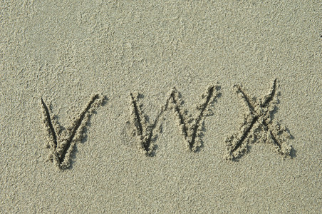 字母wvx手写在沙图片