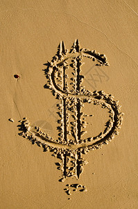 在沙子上画的美元符背景图片