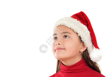 美丽的女孩戴着圣诞帽子在白之图片
