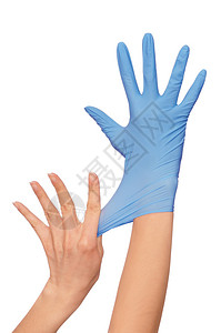 医生在手术时戴上蓝色绝育医疗手套图片