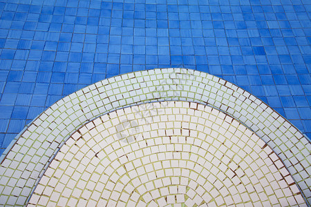池底的蓝色瓷砖背景图片