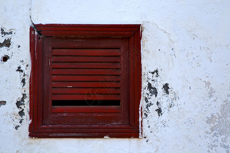 西班牙在白墙阿雷西费兰萨罗特岛的棕色木窗图片