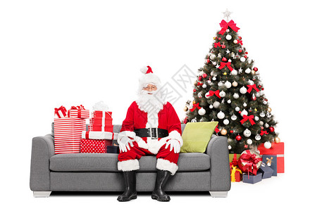 圣诞老人坐在沙地上坐在图片