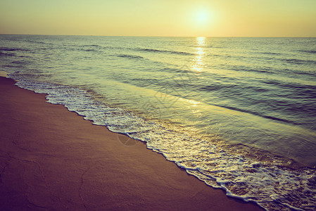 沙海滩浪和太阳耀斑图片