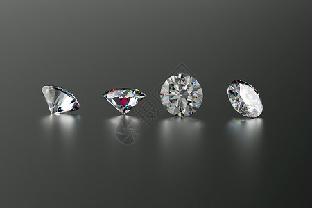 深色背景下四颗豪华钻石的特写图片