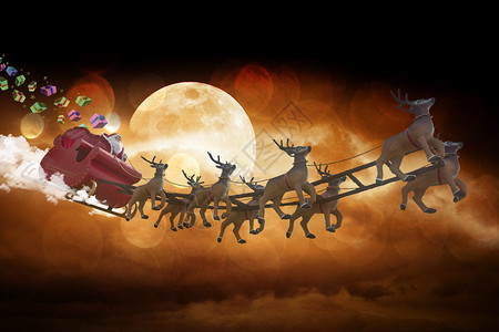 圣诞老人骑着雪橇在蓝星上图片