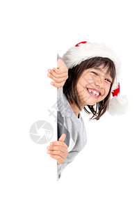 带着圣诞老人帽子的快乐女孩图片