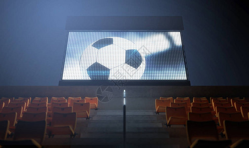 夜间在看台上显示足球重播的照明体育场大屏幕图片