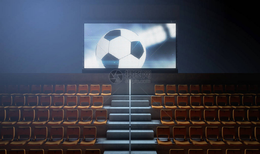 夜间在看台上显示足球重播的照明体育场大屏幕图片