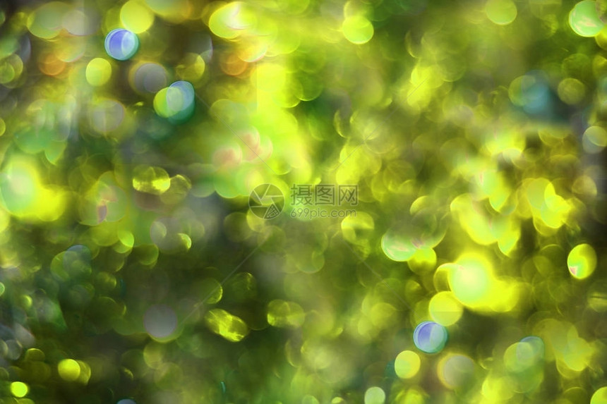 淡色绿和黄色的bokeh背景用于设计的Festi图片