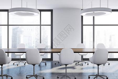 白色桌内有水泥地板阁楼窗户长木板桌和白椅子的白衣室内背景图片