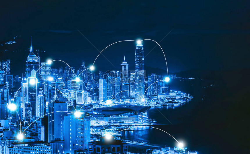 香港市区及维多利亚港的数码网络连接线智慧城市金融区技术理念摩天大楼和高层建筑夜间鸟瞰图图片