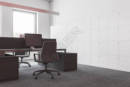 现代办公室的内部有白色的墙壁铺有地毯的地板和灰色的电脑桌图片