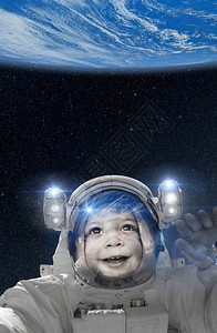 太空服儿童宇航员从太空向地球挥手图片