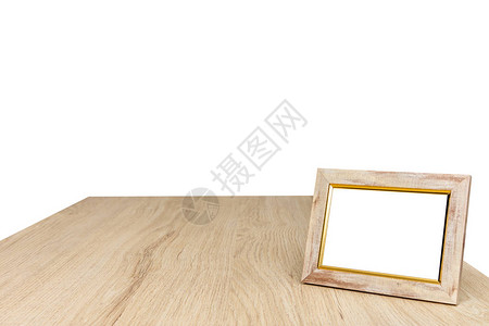 关闭木制桌上的空白照片框图片