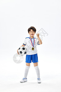 踢足球的小男孩获奖形象背景图片