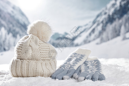 温暖手套雪地上的保暖装备背景