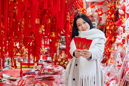 采购年货新年装饰的女性形象背景图片