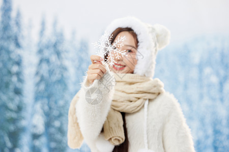 手拿雪花素材手拿雪花片的可爱冬季女孩背景