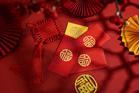 扇子中国结新年中国结与烫金红包背景