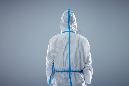 新型冠状病毒感染穿防护服的医护人员背影背景