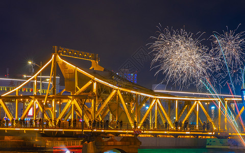 夜晚点亮了桥梁天津海河两岸风光与烟花夜景背景