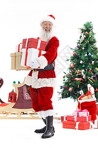 圣诞老人抱着礼品盒图片