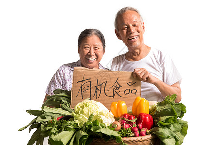 农民夫妇出示自家蔬菜现代高清图片素材
