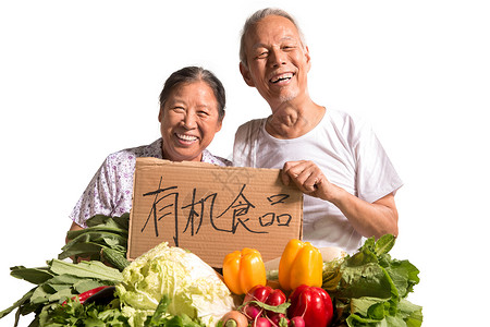 农民夫妇出示自家蔬菜人高清图片素材