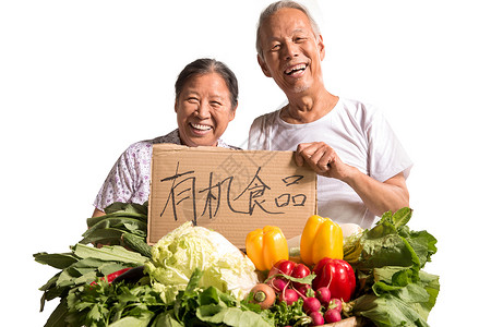 农民夫妇出示自家蔬菜蔬菜水果商高清图片素材