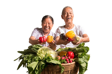 农民夫妇出示自家蔬菜满意高清图片素材