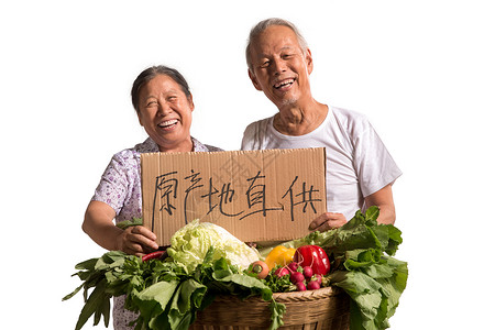农民夫妇出示自家蔬菜绿色食品高清图片素材