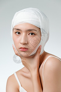 青年女人做面部整形手术脸高清图片素材