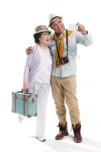 老年夫妇旅行拍照图片