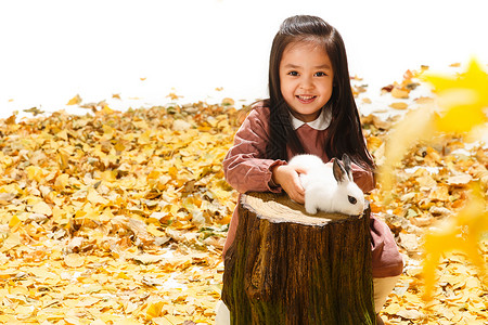 微笑小萝莉小女孩和小兔子背景