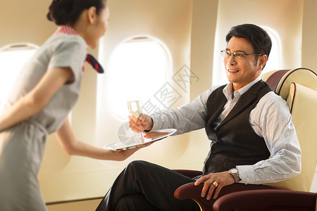 男大眼镜素材商务男士乘坐飞机背景