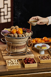 中国新的一年围炉炭火喝茶吃点心背景