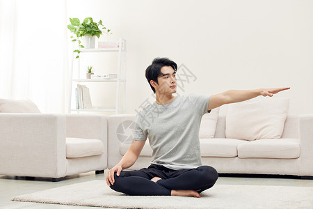 居家男性锻炼瑜伽背景图片