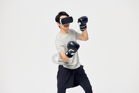 戴着拳套的男性使用vr眼镜背景图片