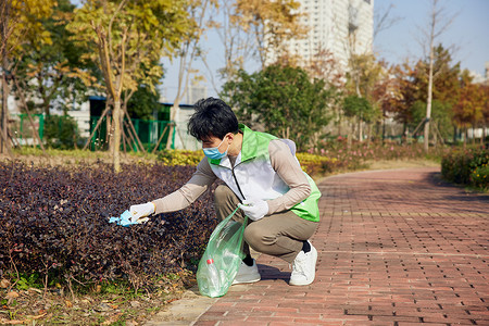 世界清洁地球日户外环保志愿者捡拾垃圾背景